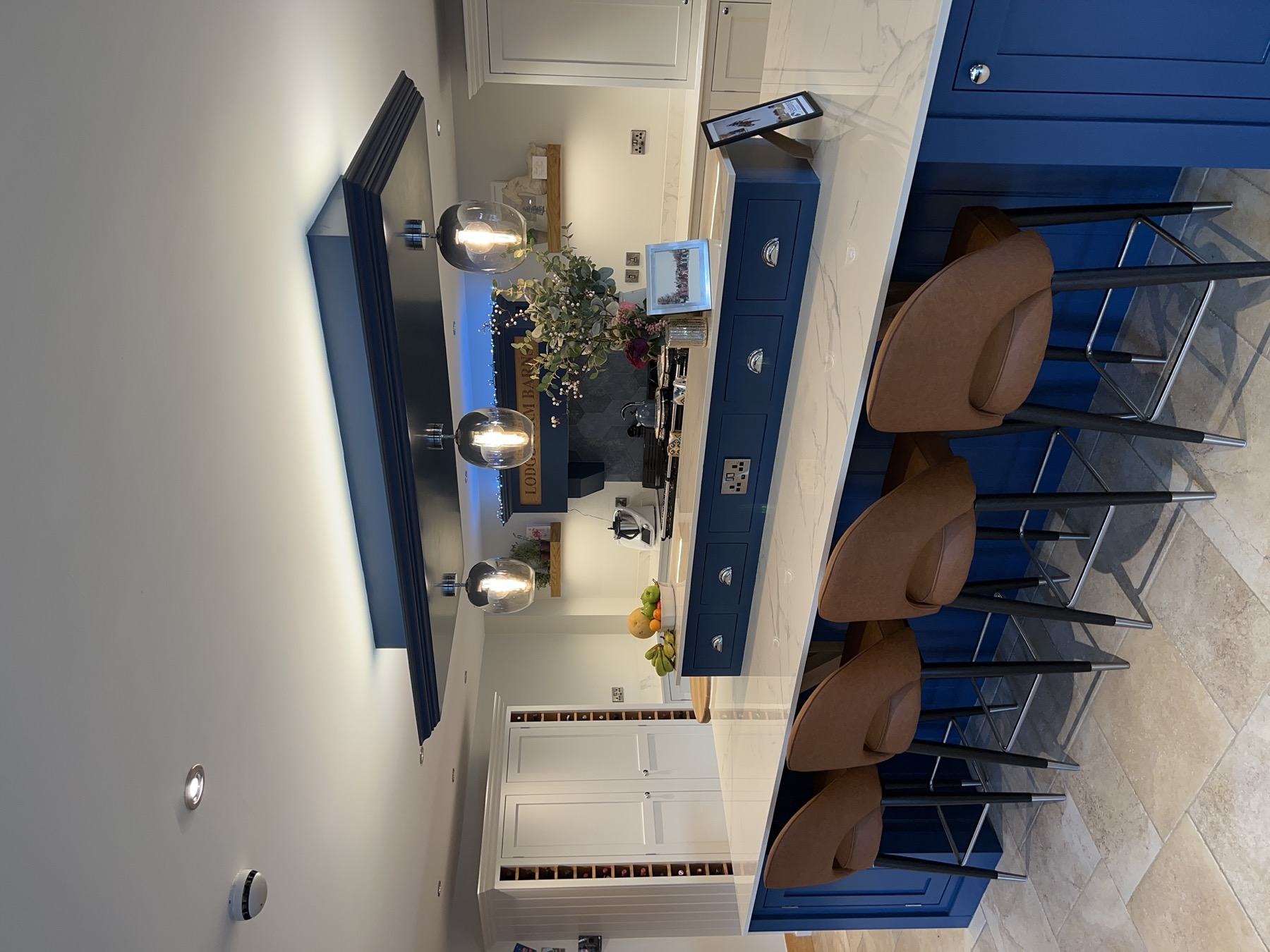 Lodge Farm — navy kitchen at dusk