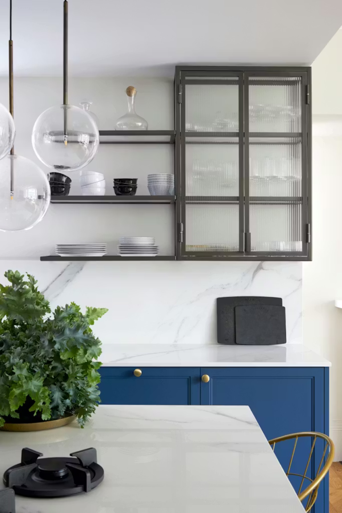 Eton Avenue — glass display cabinets and marble worktop